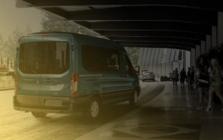 Ford Transit picking up passengers